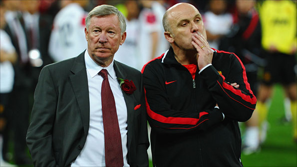 Manchester United manager Sir Alex Ferguson and his assistant Mike Phelan
