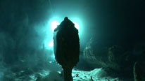 A backlit stalagmite in a submerged Mallorcan cave