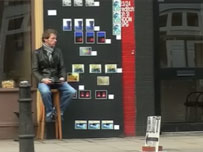 Roger Molloy displaying his artwork