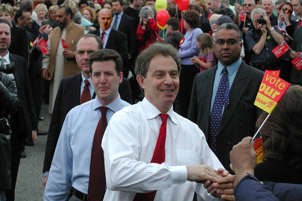 clue: they are somewhere behind the grinning man