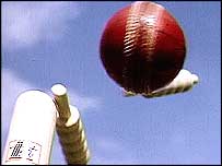 A cricket ball and stump