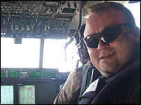 Toby in the cockpit of a Hercules aircraft