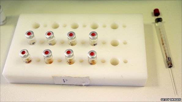 Syringe and small sample bottles at anti-doping laboratory