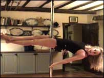 Woman pole dancing