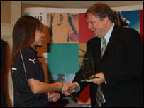 Holly receiving an award