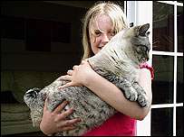 Big cat and young owner