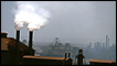 Smoke plumes coming from industrial chimneys