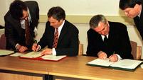 British Prime Minister Tony Blair and Irish Taoiseach Bertie Ahern sign the Good Friday Agreement (Press Association)