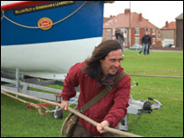 Neil Oliver helps to pull the lifeboat