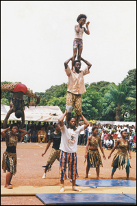 Members of a Sierra Leonean acrobatic team celebrate the 48th anniversary of Guinea's independence. 