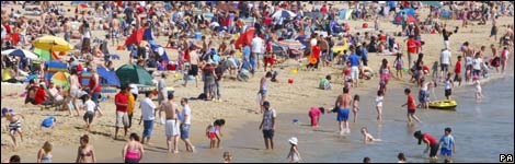 People on the beach in Bournemouth, UK