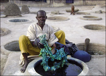 A man in Kano state uses one of many specially made pits for the dyeing of fabric
