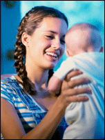 teenage girl holds baby