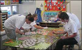 Volunteers from KPMG painting our mural