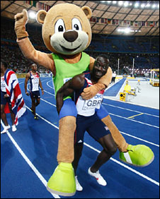 Berlino gets a piggyback from Britain's Tyrone Edgar