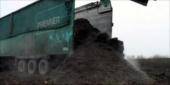 A Premier Waste lorry dumps 