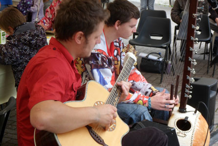 Playing the guitar and West African kora in the Up for Arts marquee in Carmarthen last weekend. Image: Coracle