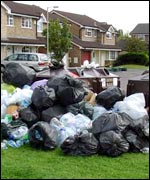Empty bottles piled by a Churchdown bottle bank