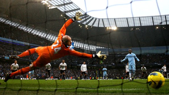Mario Balotelli scores his penalty