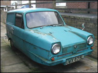 An old shabby Robin Reliant car
