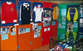 Retro City shirts displayed on wall in exhibition 