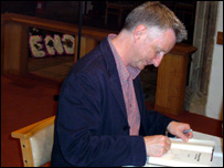 Billy Bragg signing books at St. Peter's, Oundle