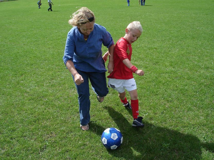 me playing footy with my nephew, Callum in a park in Warrington