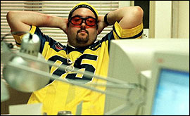 bloke asleep at a computer