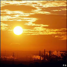 Sun clouds and chimneys