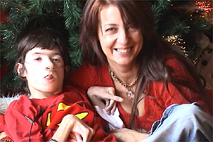 Christopher and his mum prepare for Christmas by decorating their Christmas tree.