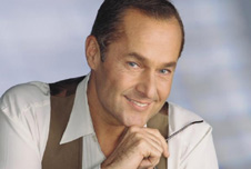 A man leaning his chin on his hand