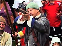 A Newton rebel fires a gun