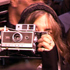Patti Smith taking a picture of CBGB's before it closes