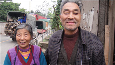 Outside Chongqing, Mr Shi Yankang and his wife are happy the Chinese government is going to knock down their old home to make way for an industrial park. They say they will receive compensation and move into a modern apartment.