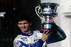 An image of Damon Hill celebrating the Formula One World Championship.