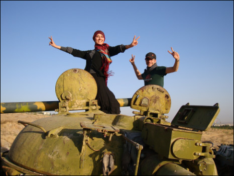 Presenter Najieh Ghulami and Producer Darius Bazargan on top of an abandoned Soviet era tank in Herat.