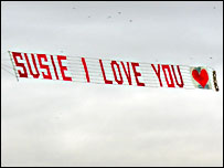 Flying banner 'Susie I love you'.