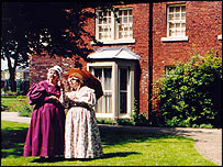 Costumed figures at Red House