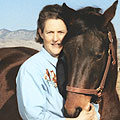 Temple Grandin pictured hugging a horse