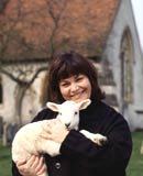 Dawn French as the Vicar of Dibley, holding a lamb