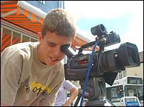 A student using a camera on the course