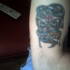 Skull & snake arm tattoo