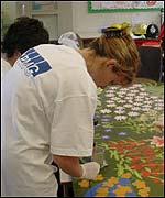 Volunteers working on the murals.