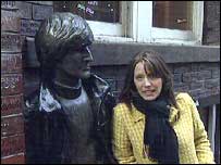 Ana Boulter stood next to a statue of John Lennon