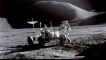 Astronaut James B. Irwin, Lunar Module pilot, works at the Lunar Roving Vehicle