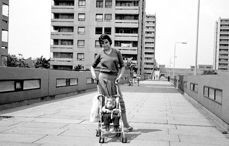 Mother pushes pram in Thamesmead, 1977