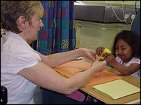 Nazifa playing with a nurse