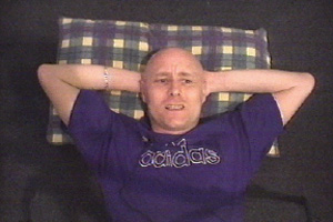 Anthony watches footage of the Kosovan war