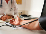 A patient having their blood pressure measured.
