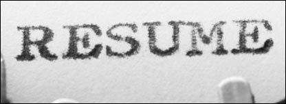 A resume or CV in a typewriter